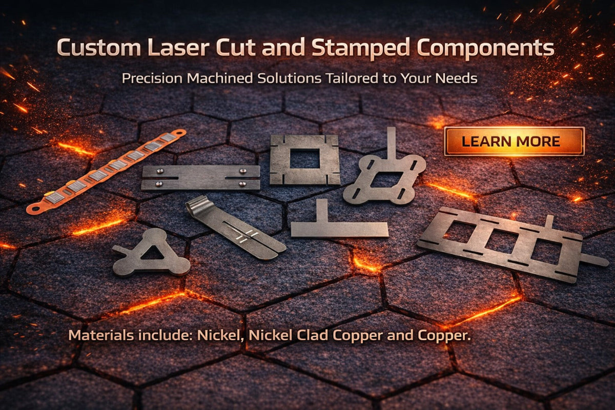 Custom laser cut and stamped components on a dark surface with glowing effects.
